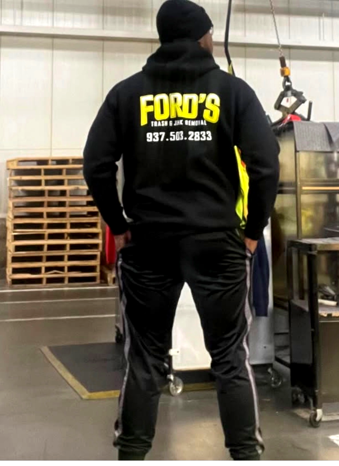 Juan Ford wearing the Ford's Trash & Junk Removal branded hoodie
